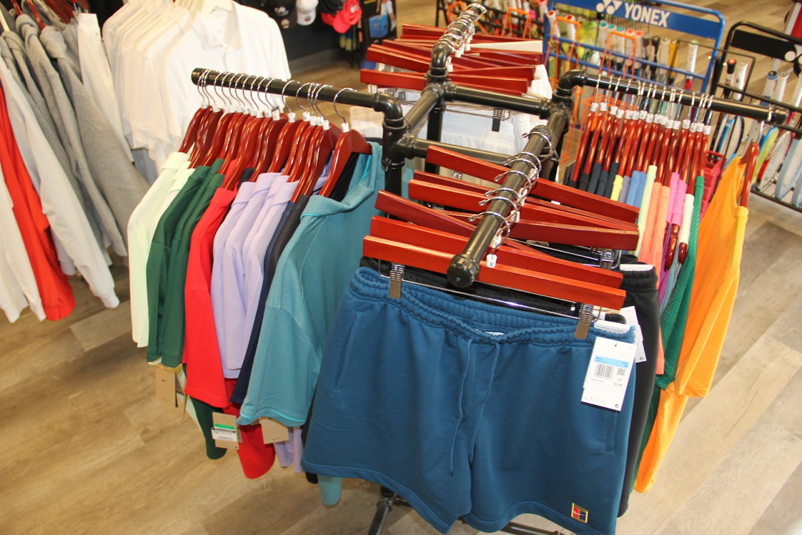 Men's tennis apparel display at Forever Tennis.