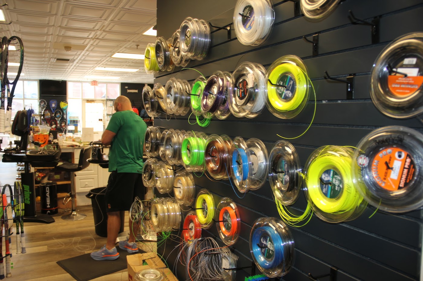 String selection at Forever Tennis showing Luxilon, Wilson, Babolat and more.