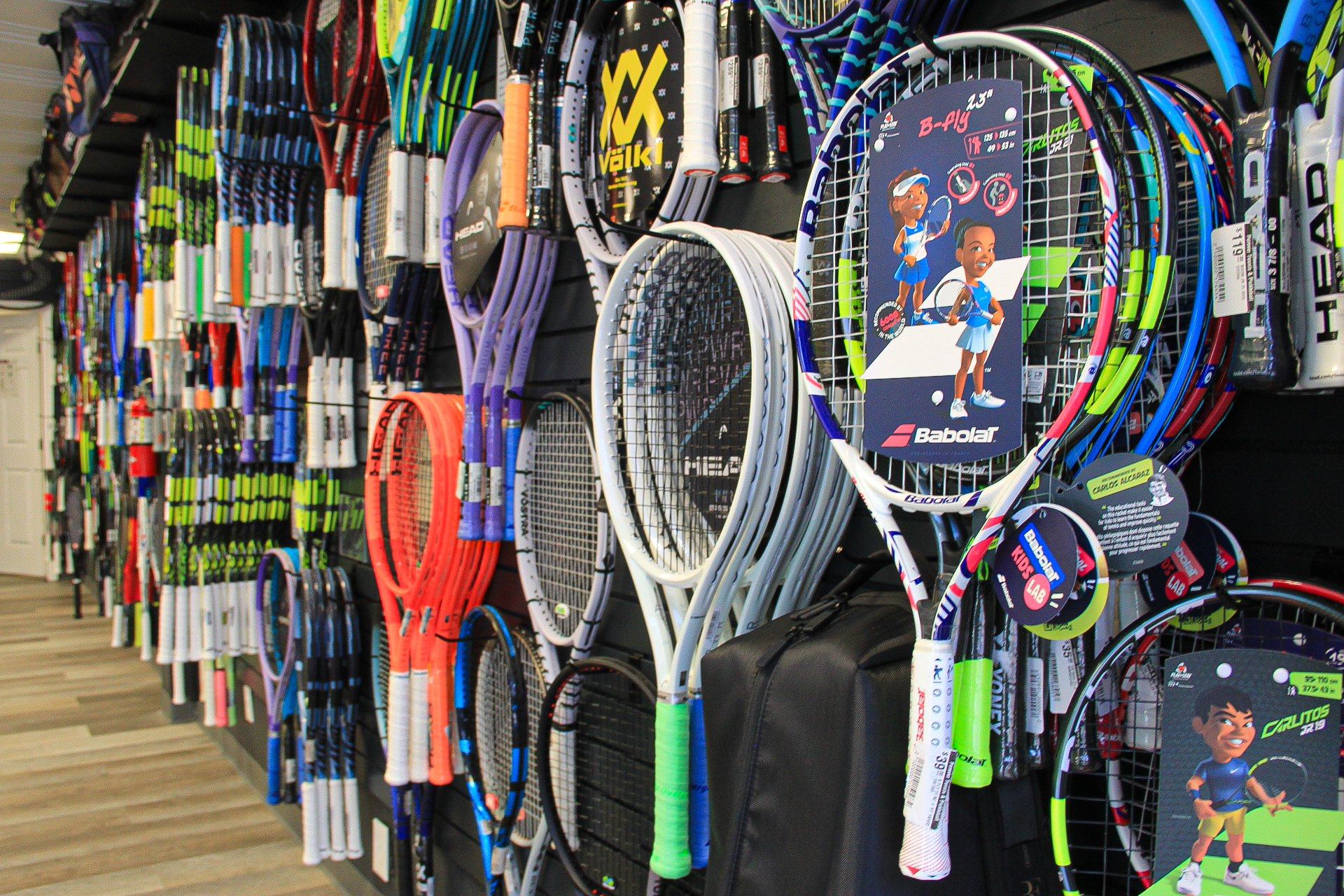 Wall of demo racquets ready to try